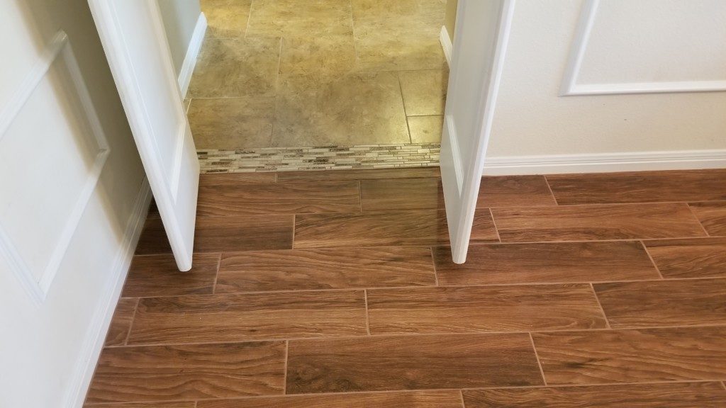 wood-look tile would be best option for new flooring