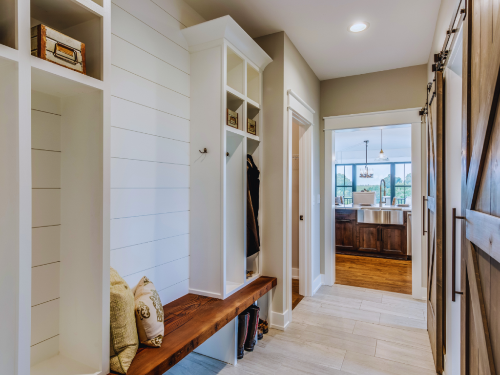Mudroom with natural wood bench